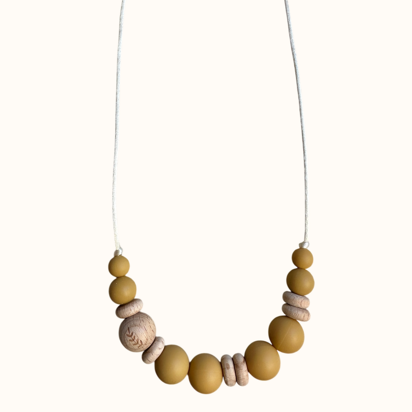 Collier d’allaitement Mawen Materne en bois et silicone perles amande